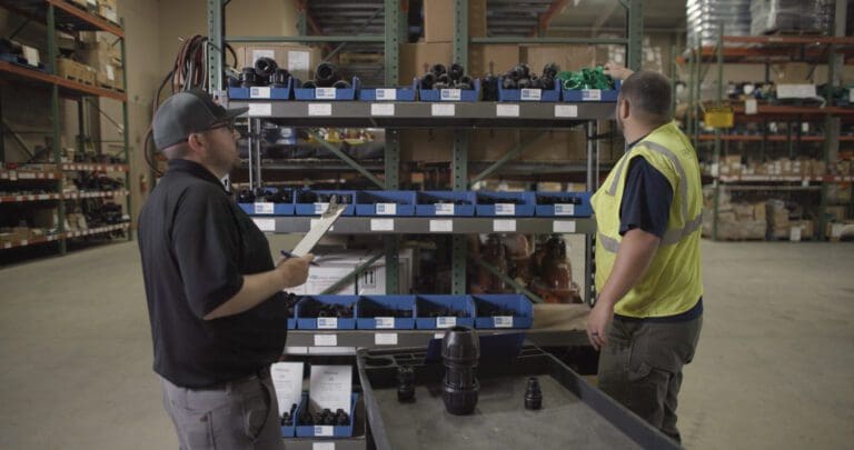 Cookeville Water Department team inspecting shelves of Philmac polymer fittings as part of their transition away from brass and evaluation of improved installation performance.