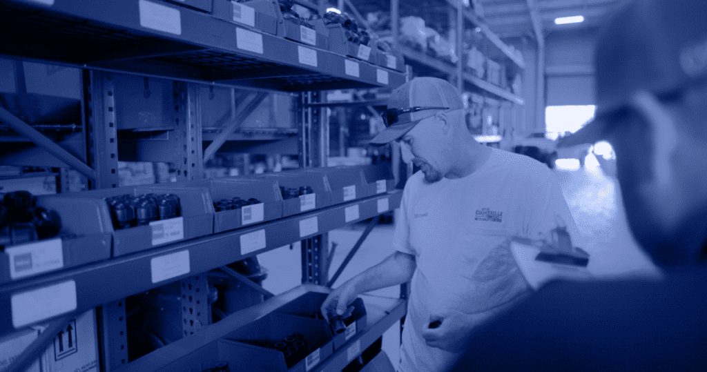 Technician in a warehouse beside Philmac fittings with a testimonial supporting the reliability of Philmac U.S. Distribution.